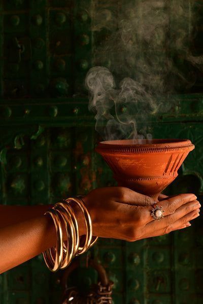 Seasonal Ayurvedic wellness ritual with clay pot